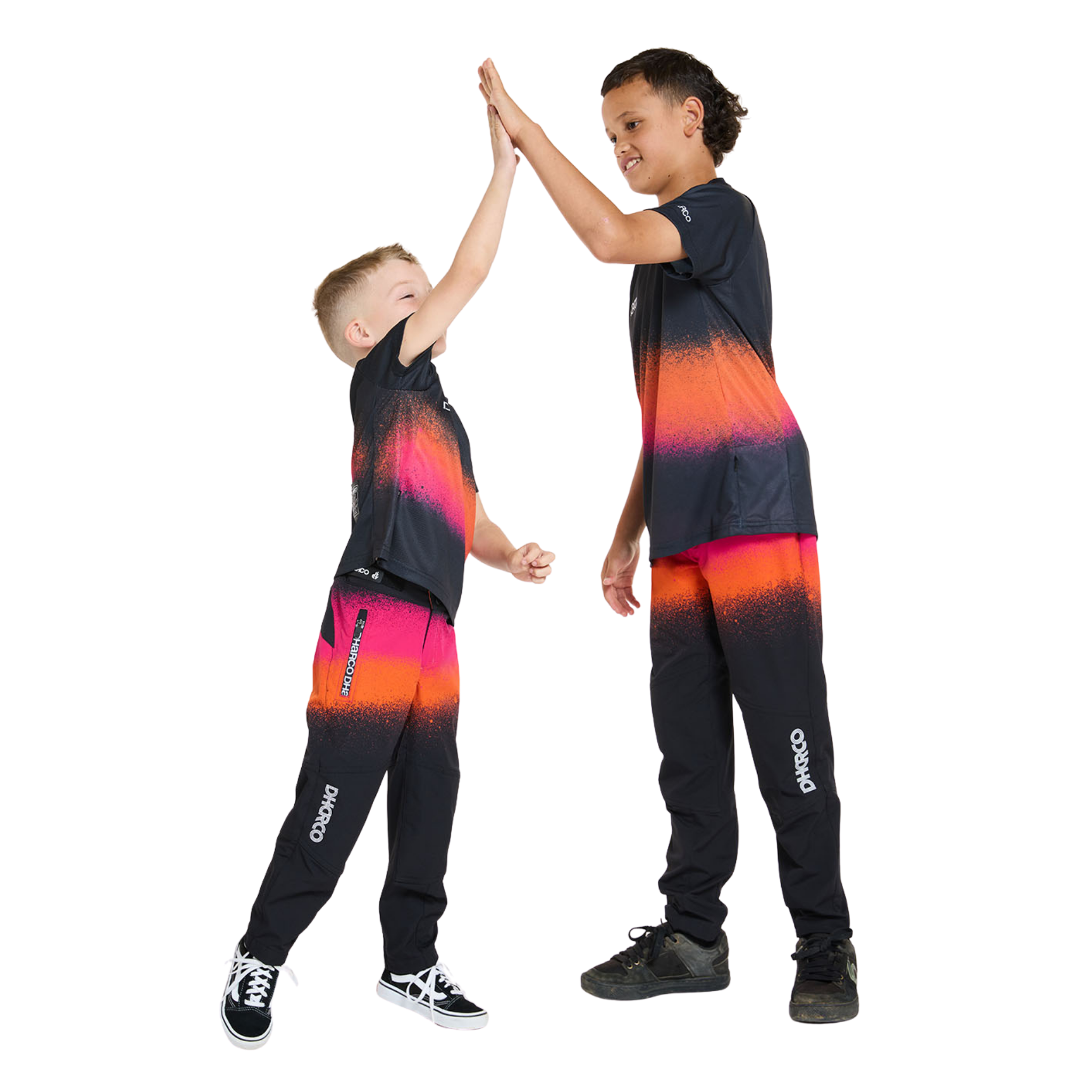 Young mountain biker wearing DHaRCO Youth Short Sleeve Jersey in Black Snake design with recycled quick-dry fabric and mesh ventilation in Whistler