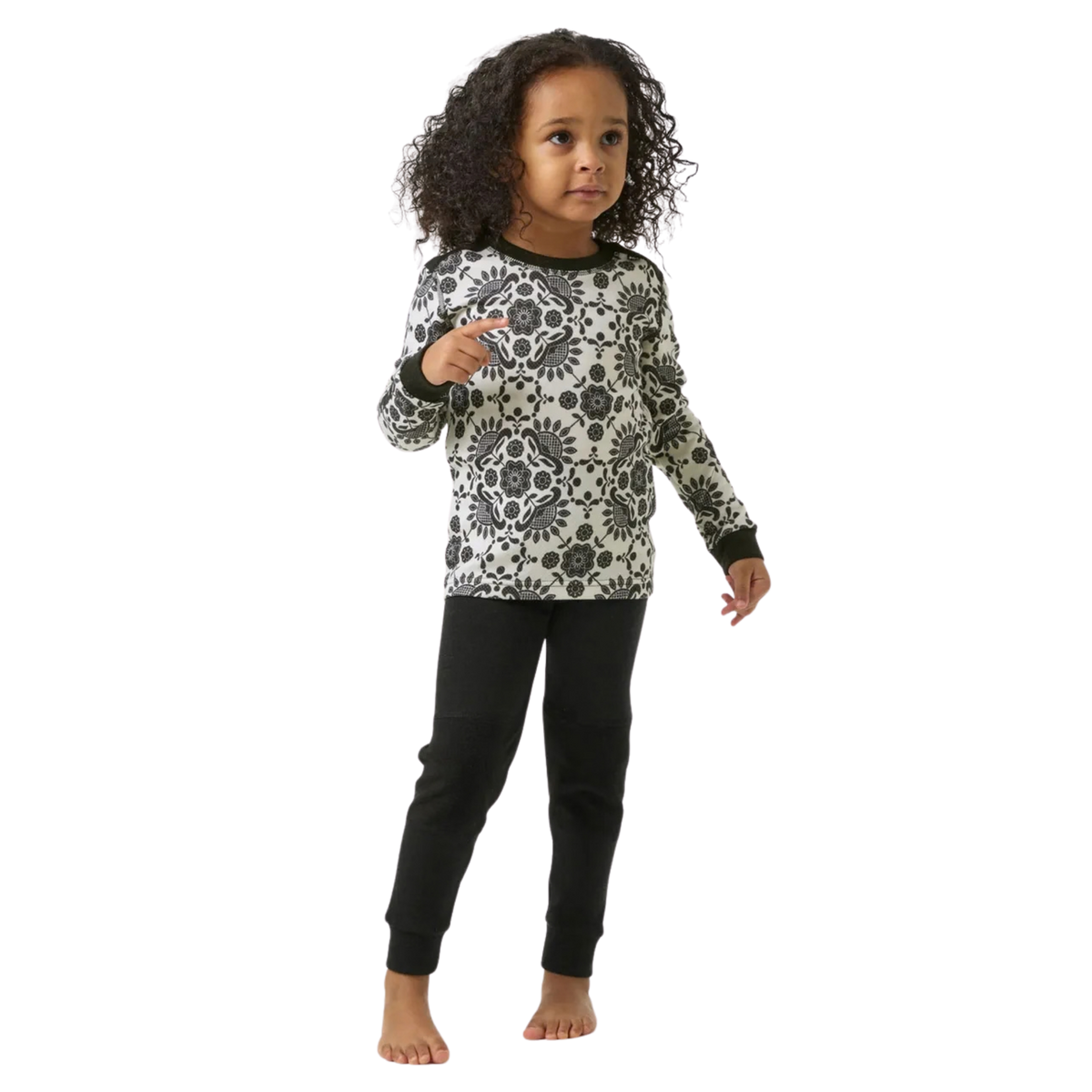 Front view of Helly Hansen Kids Graphic LIFA Merino Set in Black with thermal crew neck top and matching elastic-waist base layer pants