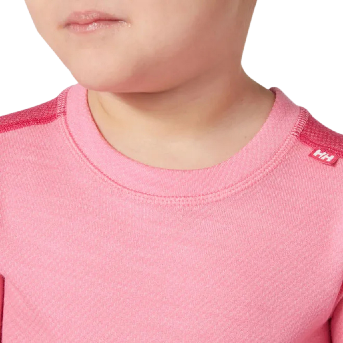 Helly Hansen Kids Lifa Merino base layer crew neck detail in Dragon Fruit color with soft warm construction for comfortable winter layering