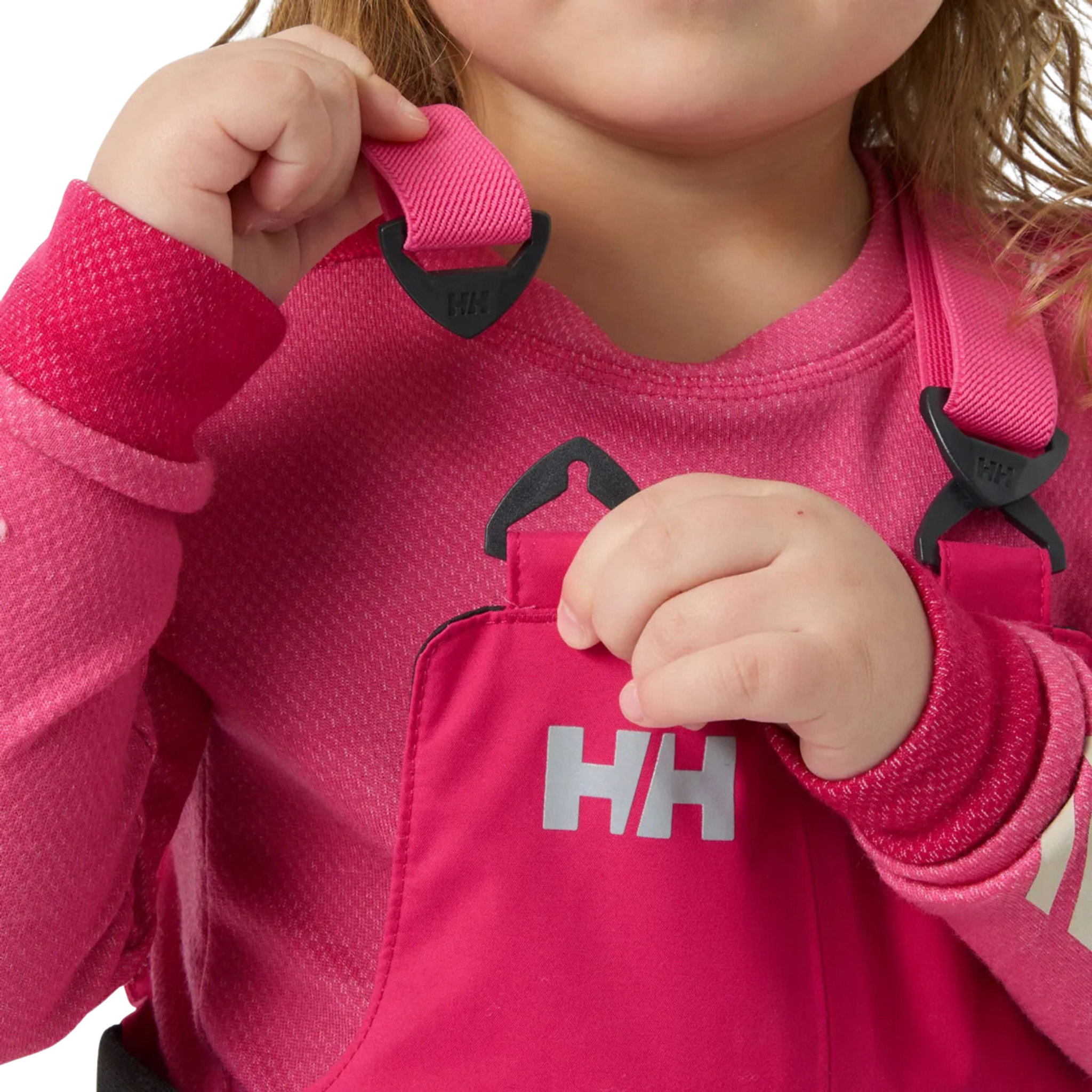 Helly Hansen Kids Rider 2.0 Insulated Bib Pants in Hot Pink with adjustable elastic suspenders for a secure customizable fit