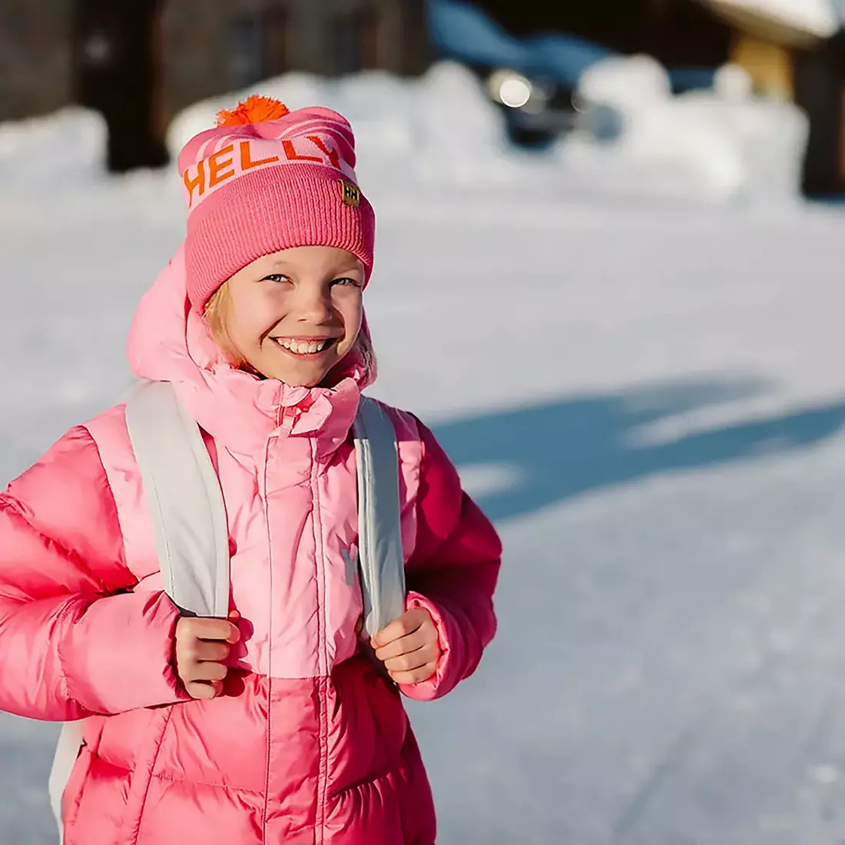 Child wearing Helly Hansen Kids Ridgeline Beanie with cozy knit fabric and ribbed cuff during a winter day in Whistler