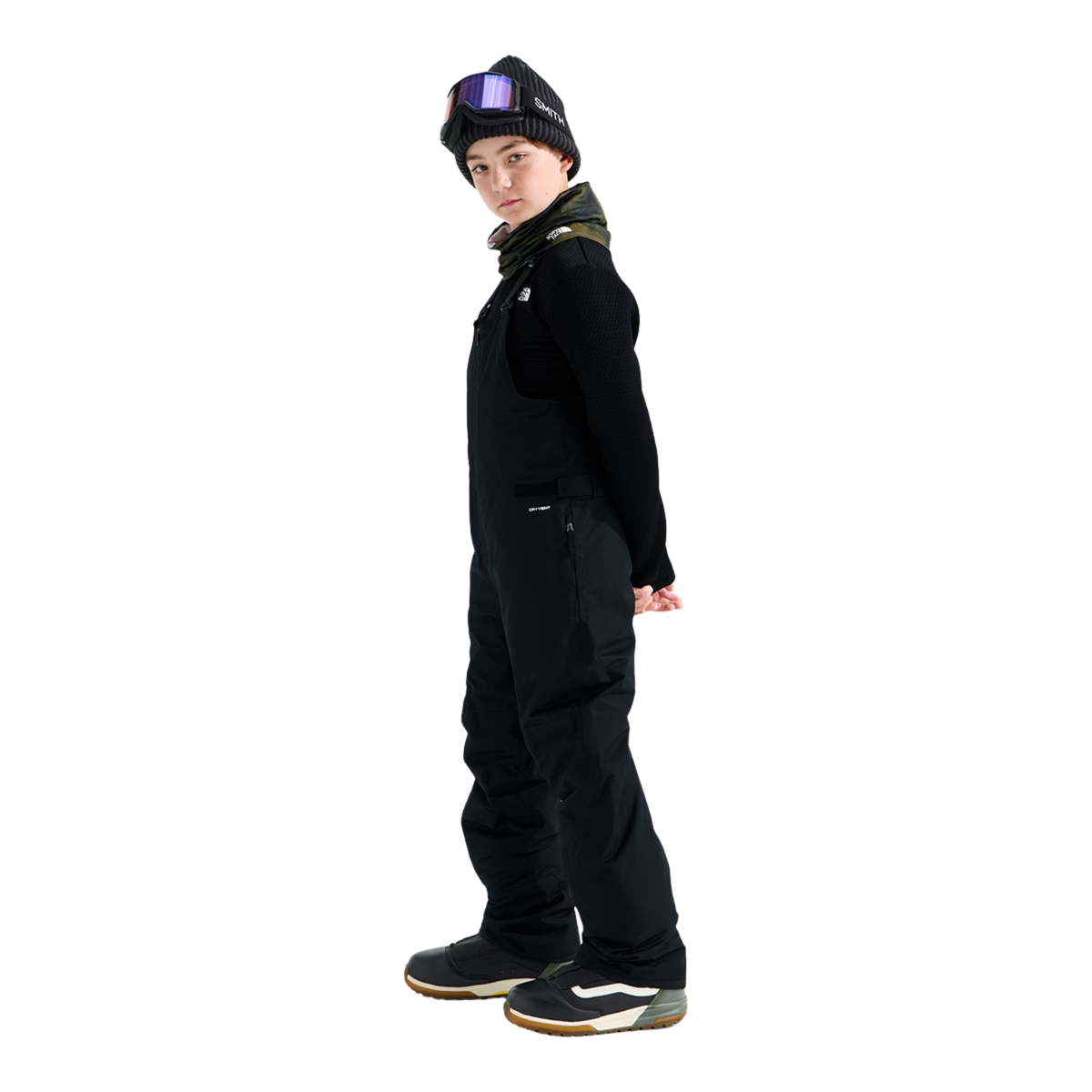 Side view of The North Face Teen Freedom Insulated Bib Pant in Black with insulated construction, adjustable waist and reinforced lower legs