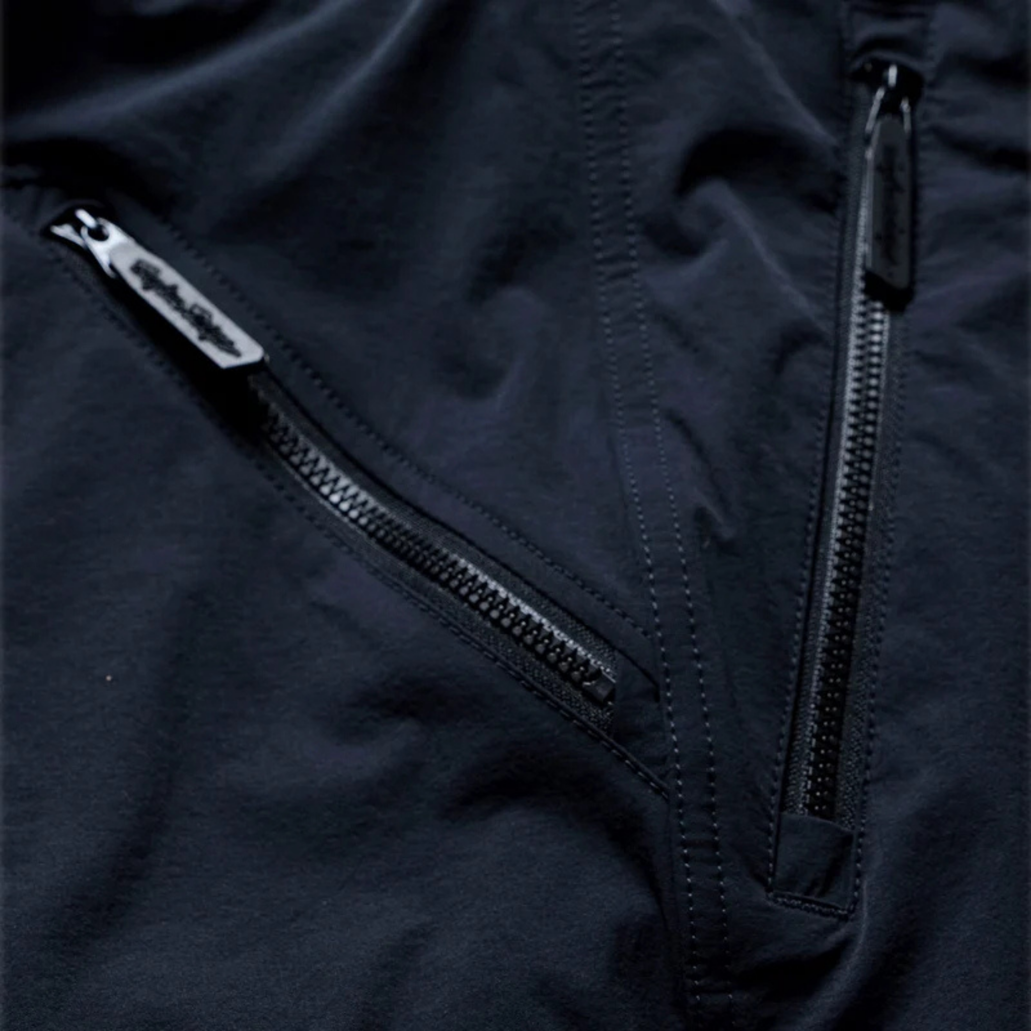 Close-up of Troy Lee Designs Skyline Trail Pant Mono Army with YKK zippered storage pockets