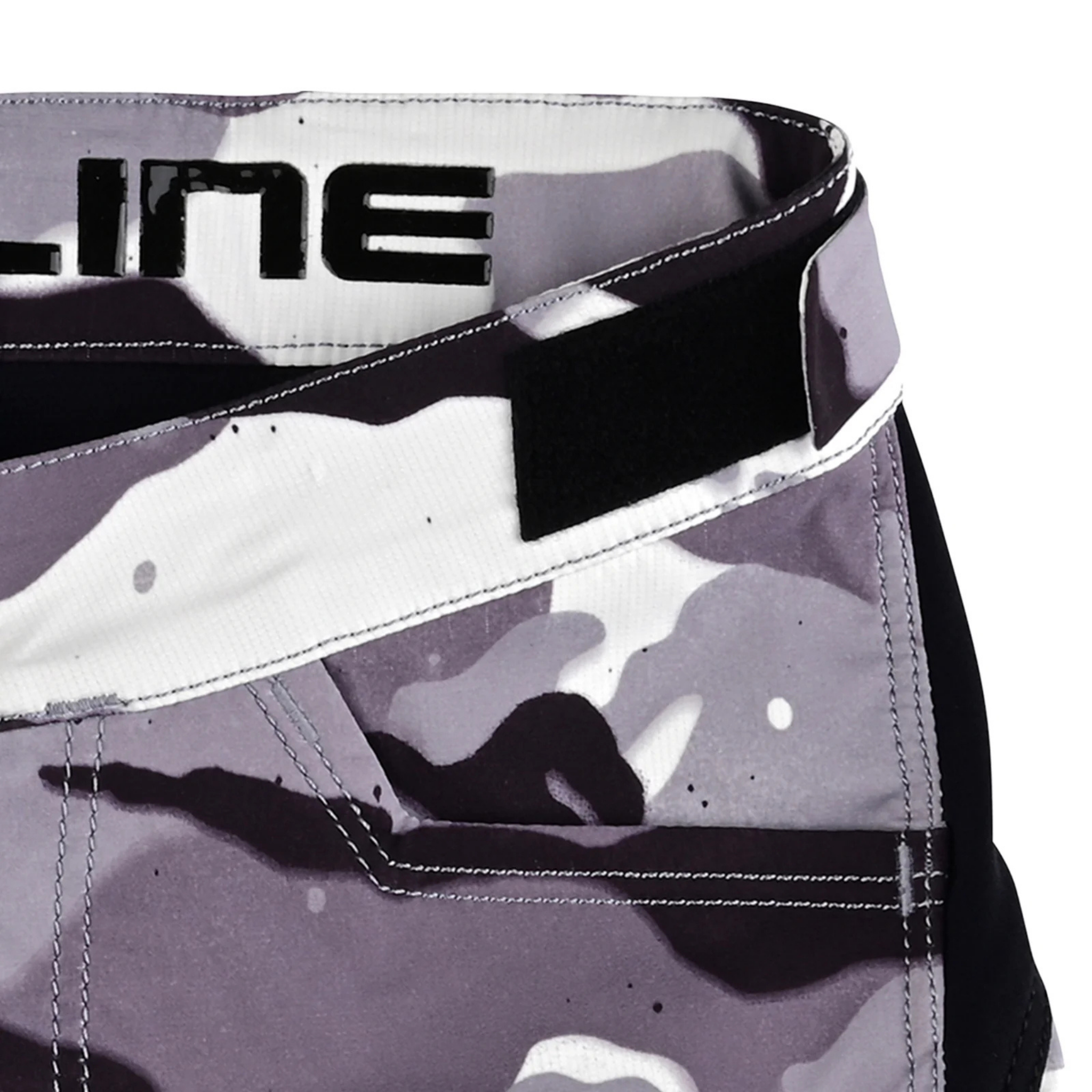 Close-up of the adjustable waistband and silicone grip on Troy Lee Designs Youth Flowline Short Shell in Spray Camo White