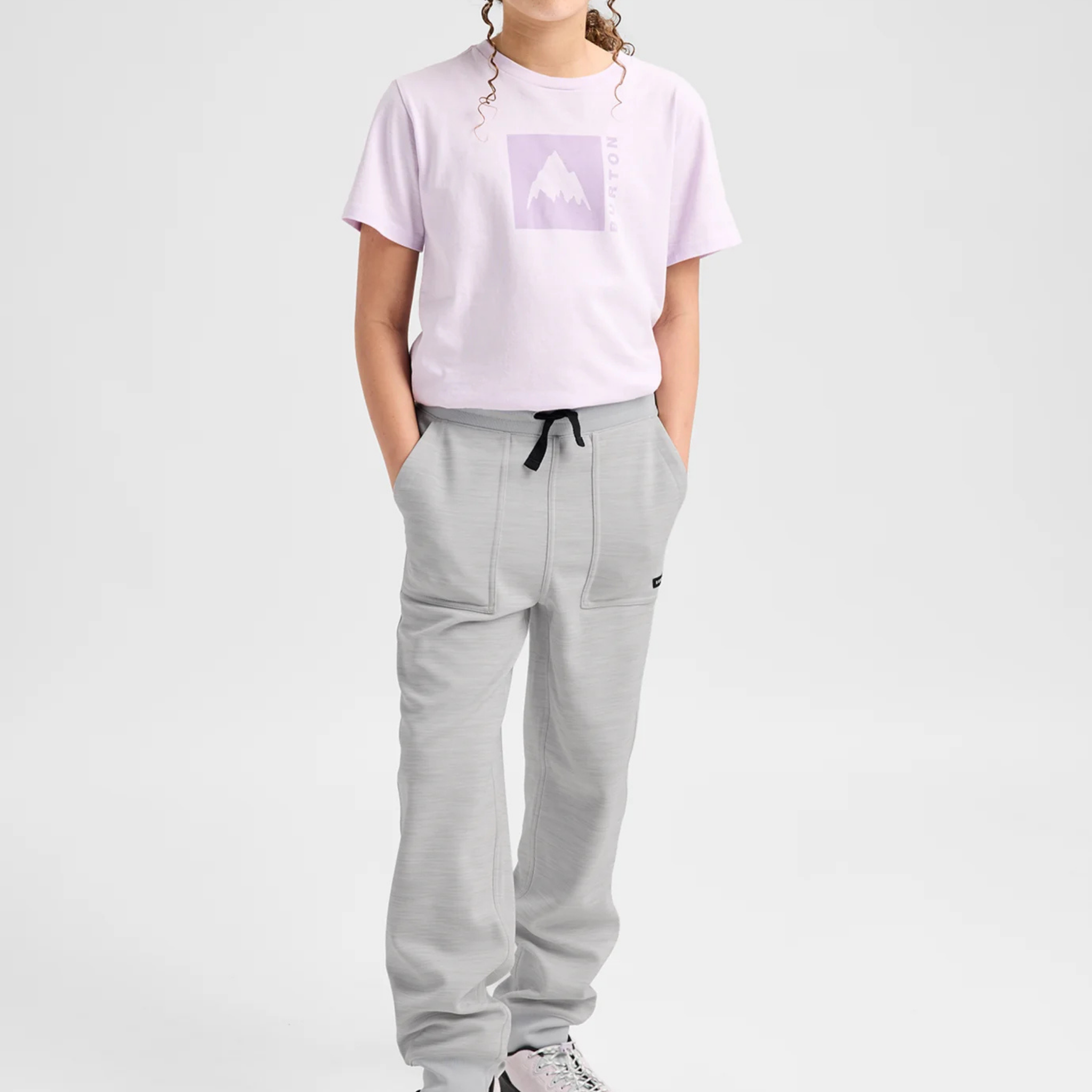 Child wearing Burton Kids Oak Fleece Pants Grey Cloud with soft recycled brushback fleece and ribbed cuffs during a casual day in Whistler