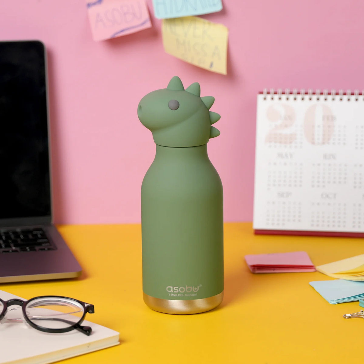 Child carrying Asobu Animal Bestie Bottle in Dino design with removable silicone character head during an everyday adventure in Whistler