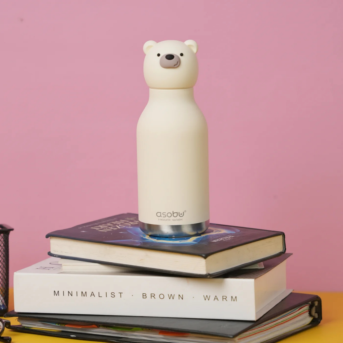 Child carrying Asobu Animal Bestie Bottle in Polar Bear design with removable silicone character head during an everyday adventure in Whistler