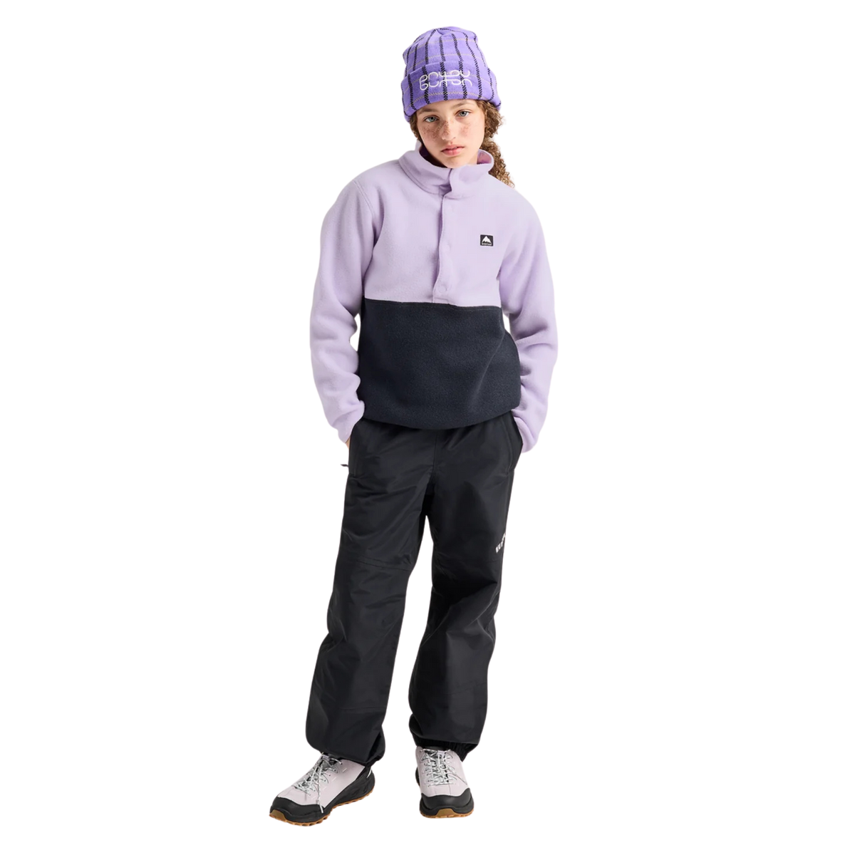 Child wearing Burton Kids Cinder Fleece Anorak in Moondust Purple / True Black with recycled polar fleece during a cool-weather outdoor adventure in Whistler