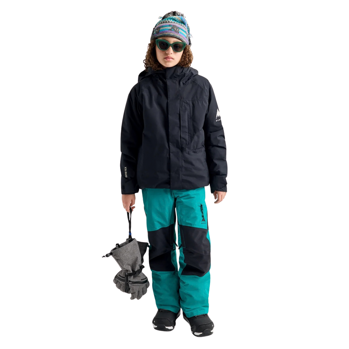 Child wearing Burton Kids GORE-TEX Powline Jacket with waterproof protection and Thermacore insulation while skiing in Whistler