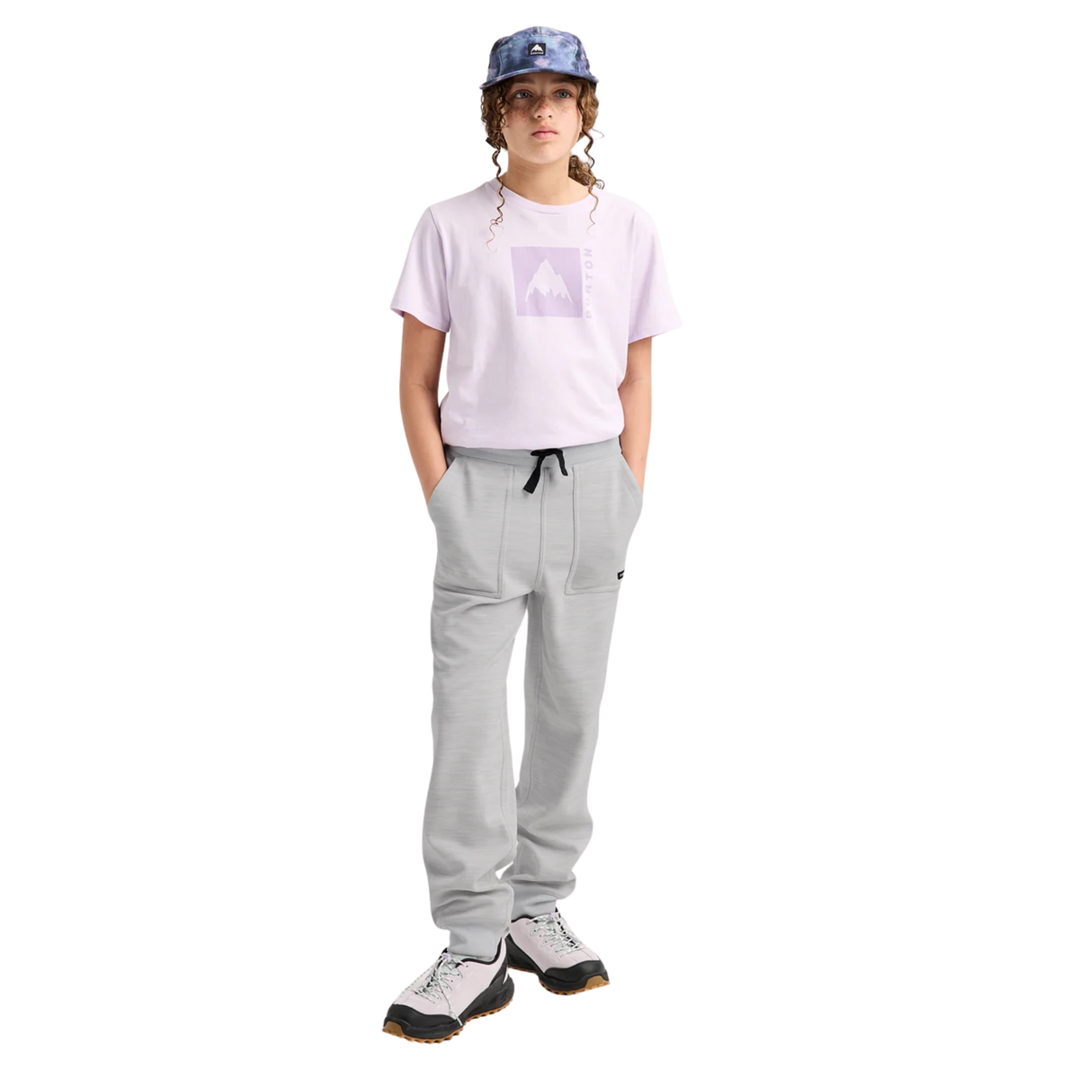 Child wearing Burton Kids Oak Fleece Pants in Grey Cloud Heather with recycled brushback fleece during a cool-weather day in Whistler