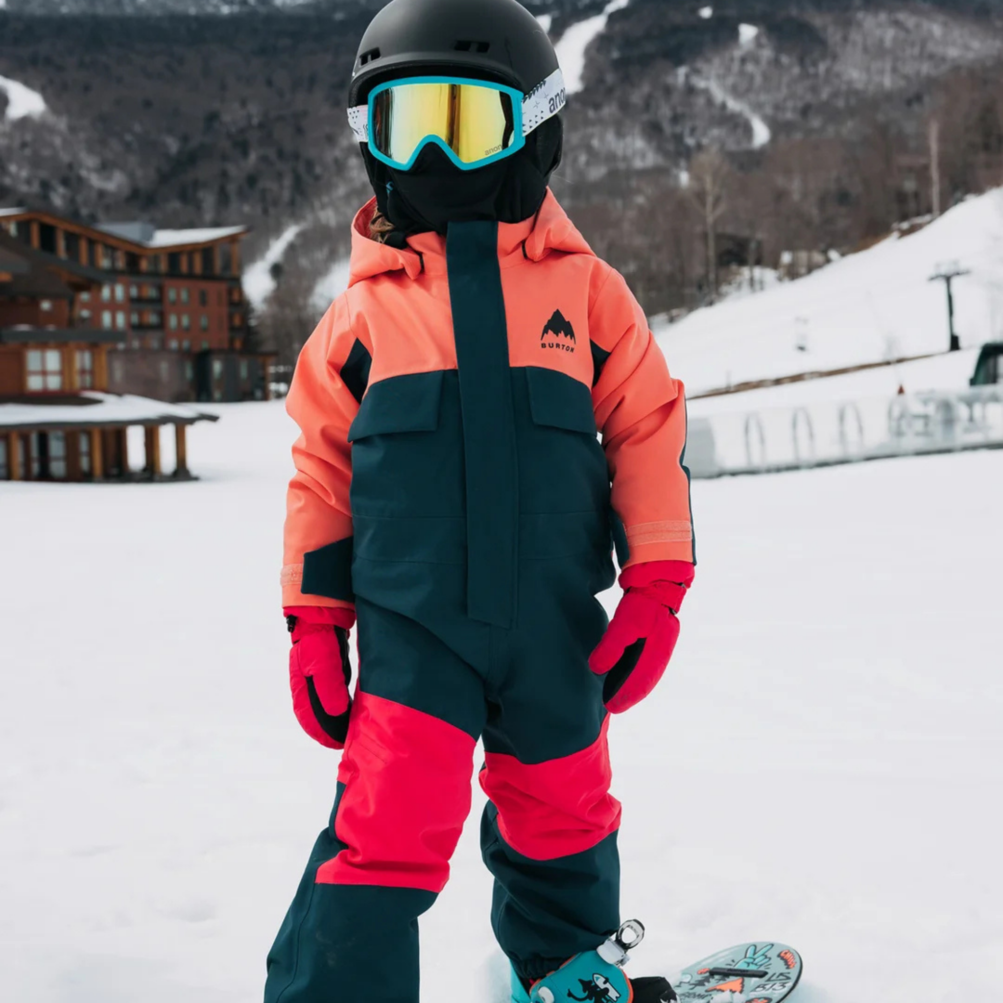 Front view of Burton Kids One-Piece Snowsuit in Peach Echo / Deep Emerald design with 15K waterproof protection and 100g ThermacoreECO insulation 