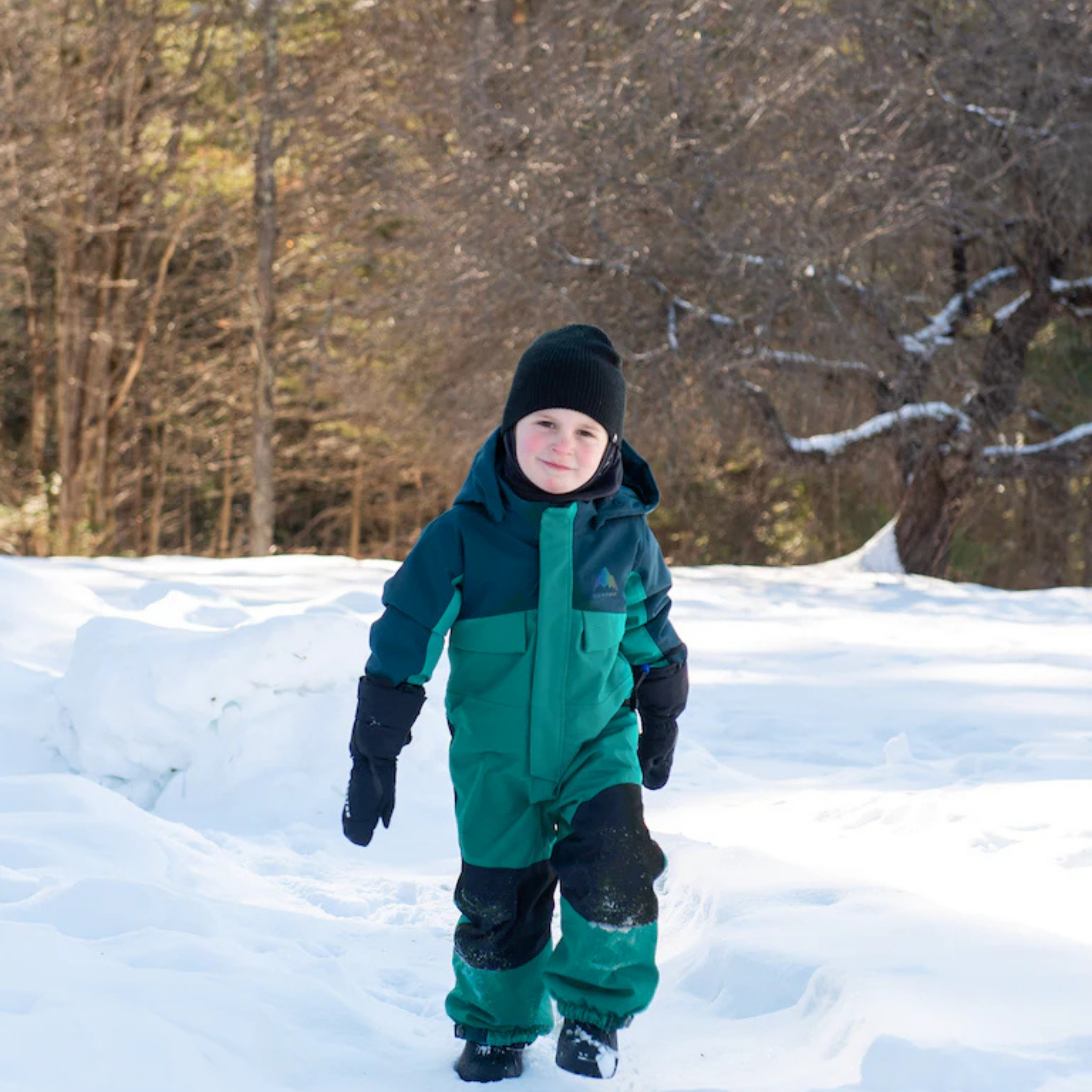 Toddler wearing Burton One-Piece Snowsuit with 100g insulation and 15K waterproofing in Whistler snow