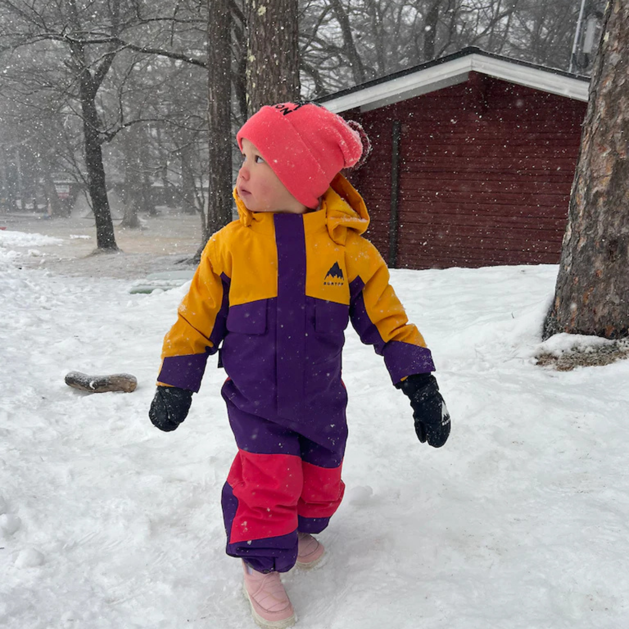 Toddler wearing Burton One-Piece Snowsuit with 100g insulation and 15K waterproofing in Whistler snow