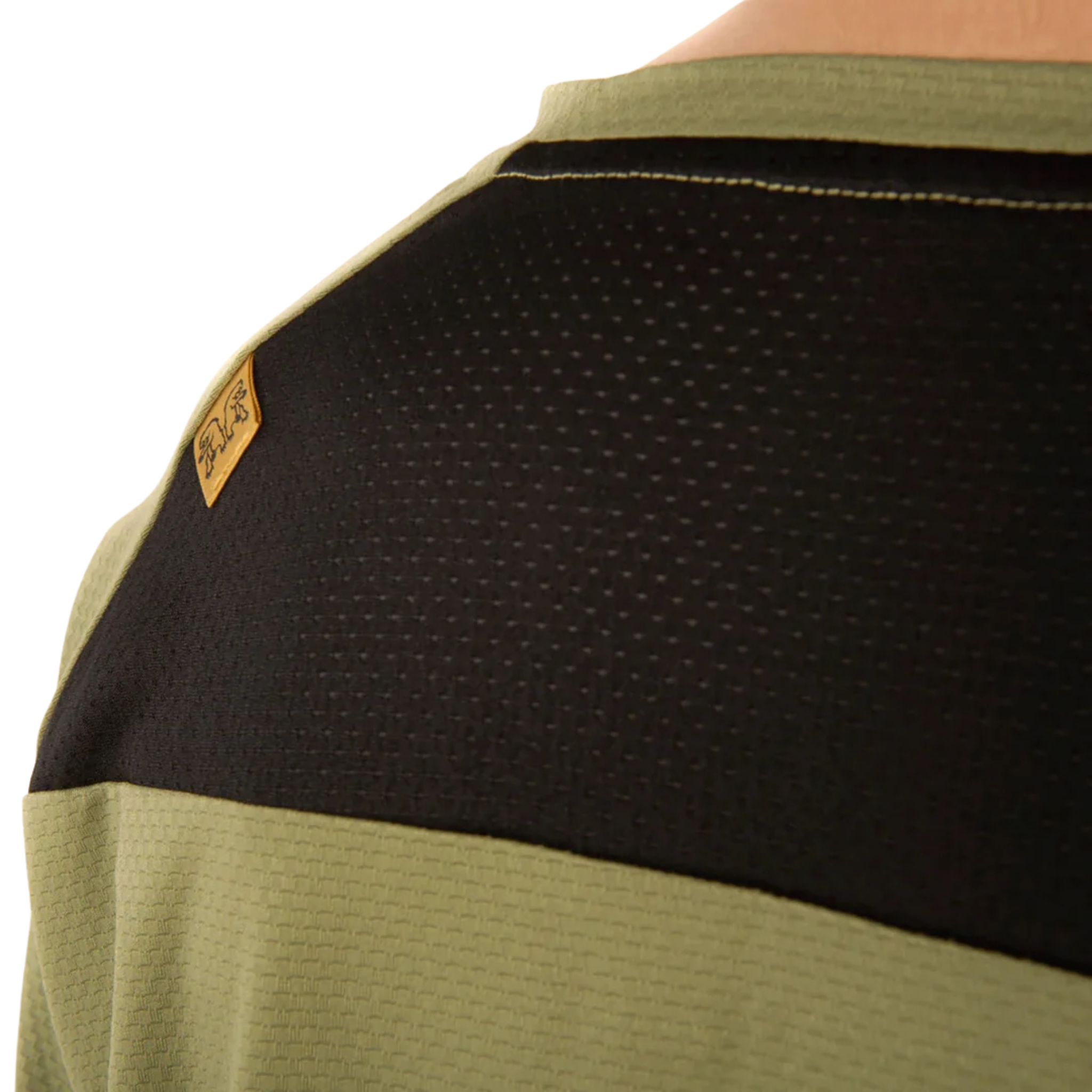 Close-up of the breathable mesh back and underarm panels on the Chromag Dominion LS jersey in Bear Rider Sage design