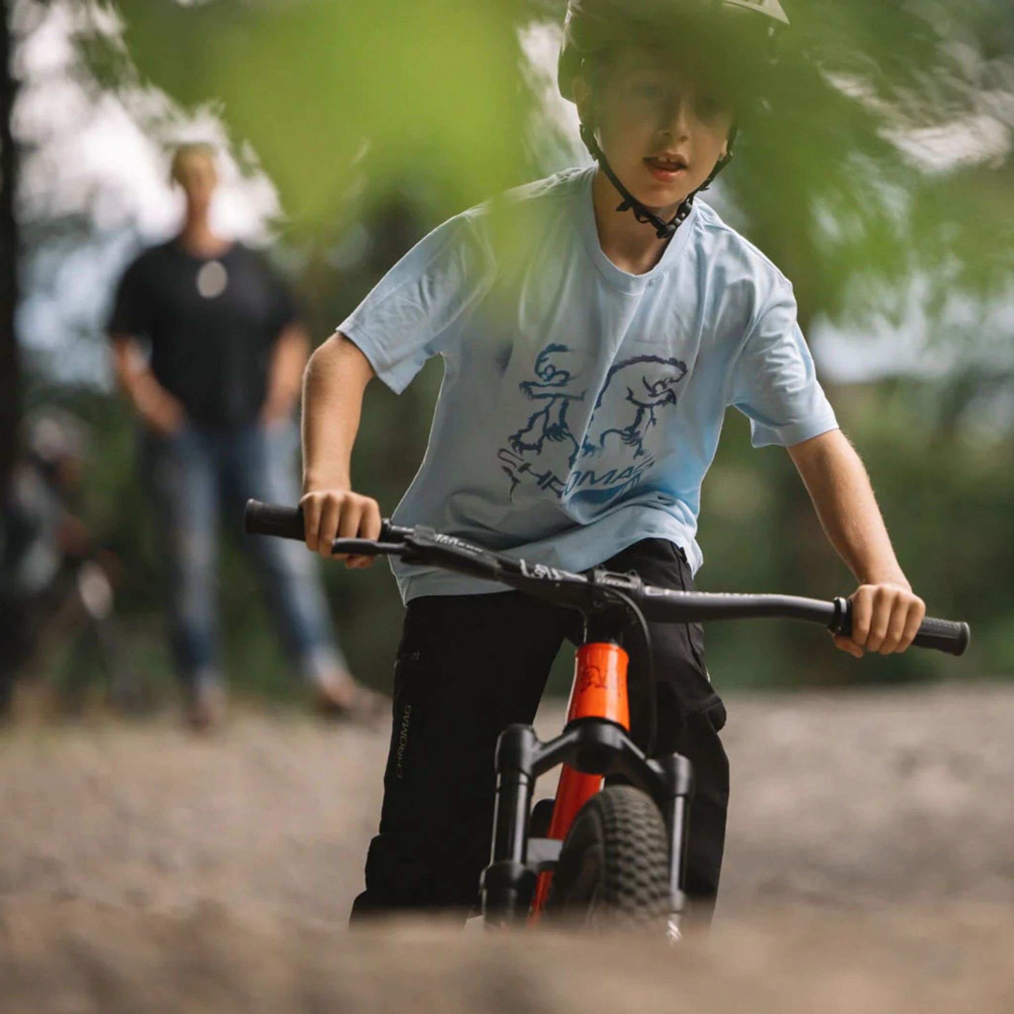 Young mountain biker wearing Chromag Punk kids tee in Whistler