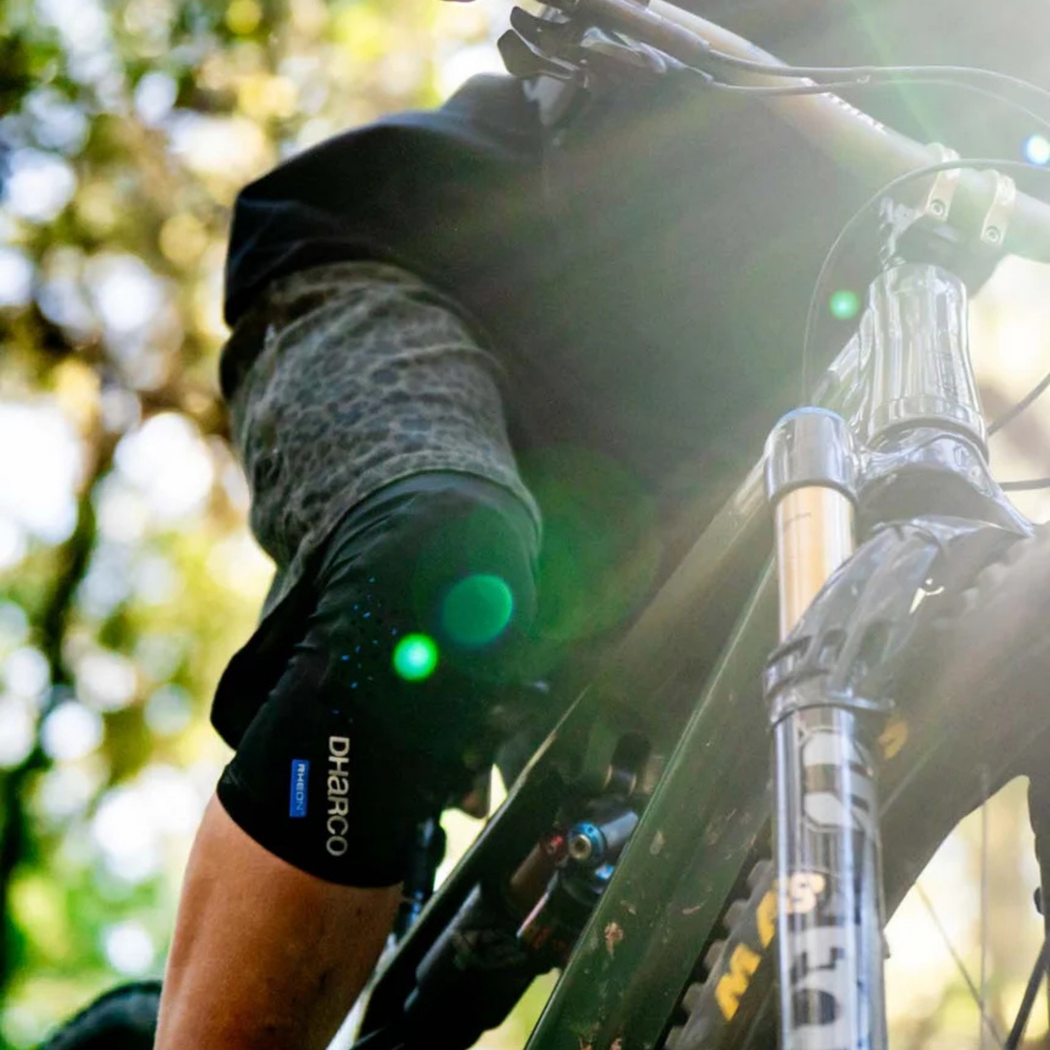 Young mountain biker wearing DHaRCO Youth Trail Knee Pads with CE-certified RHEON protection while trail riding in Whistler
