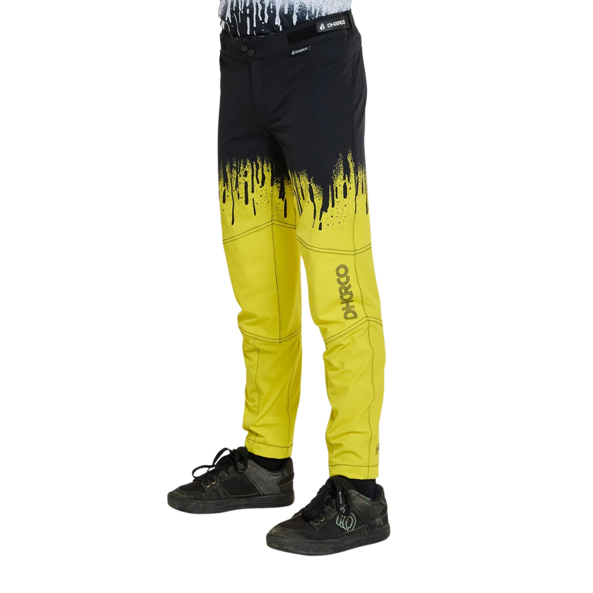 Side view of DHaRCO Youth Gravity Pants in Acid Rain design with articulated cut, knee pad room and breathable 4-way stretch fabric