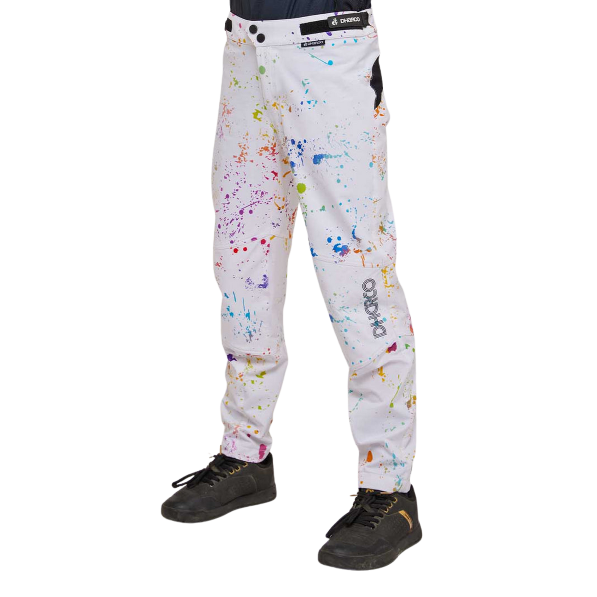Side view of DHaRCO Youth Gravity Pants in Paint Splat design with articulated cut, knee pad room and breathable 4-way stretch fabric