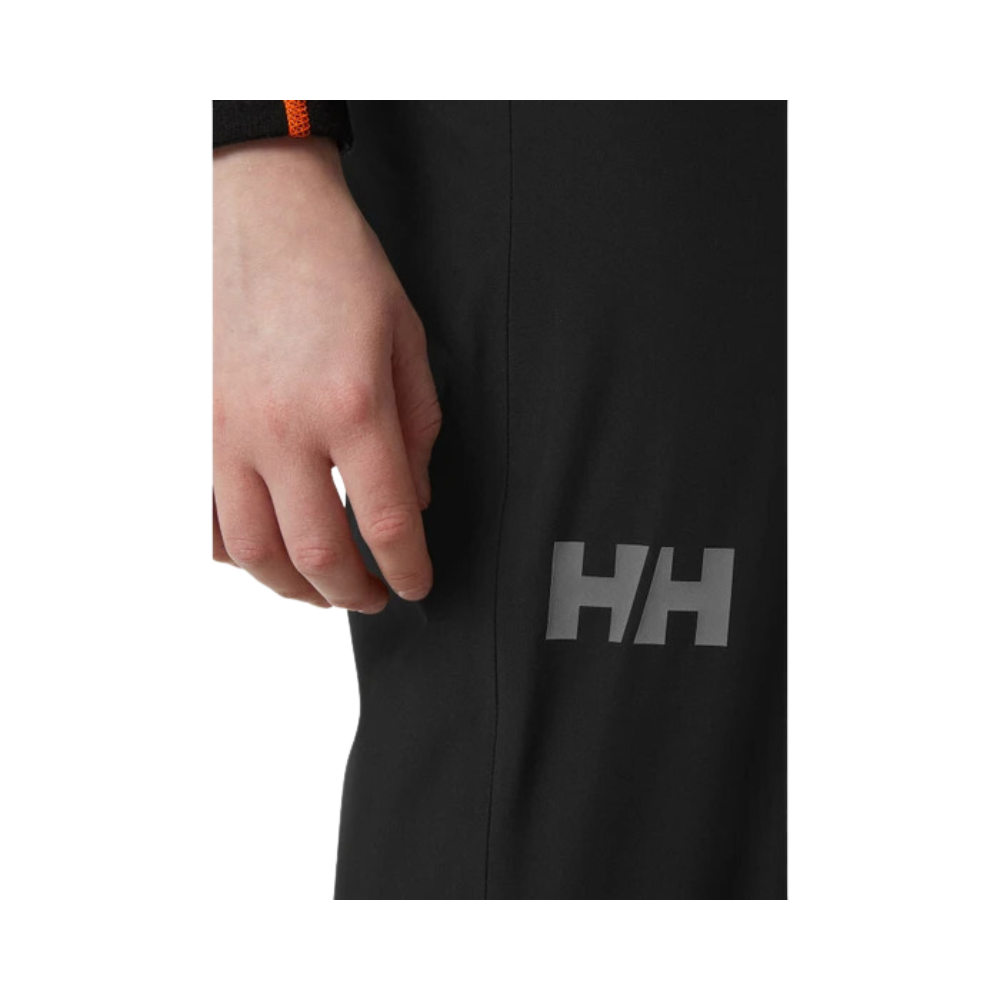 Side view of Helly Hansen Junior Juell Rain Pant with brand logo.