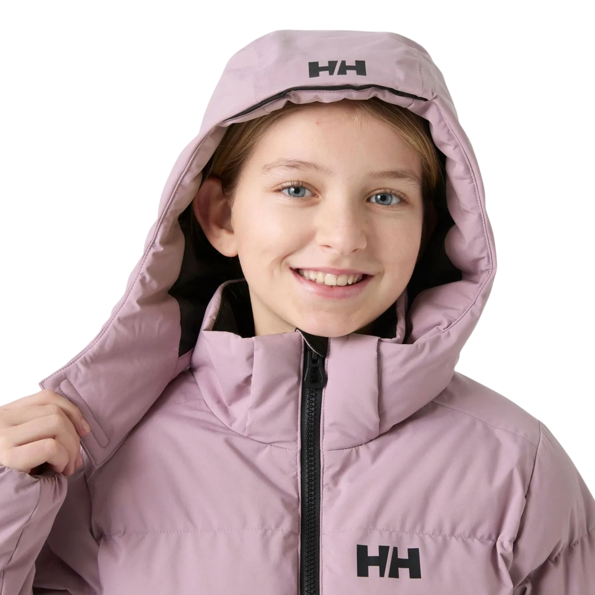 Helly Hansen Jr Girl Nora Puffy Ski Jacket in Purple Clay with detachable hood attachment designed for versatile mountain and everyday winter use