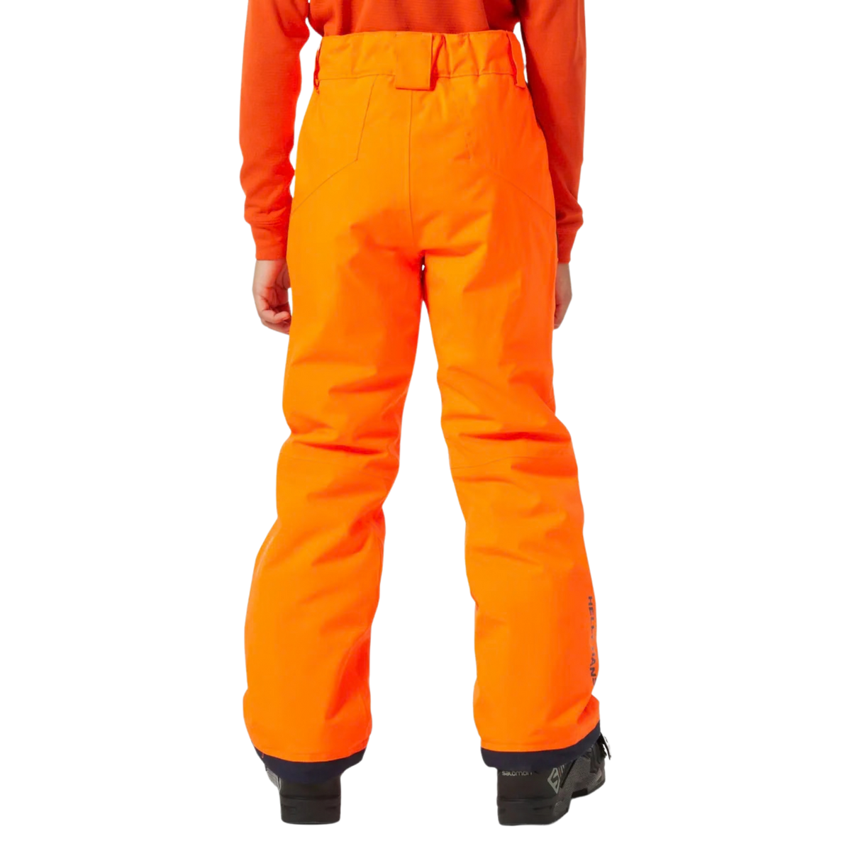 Junior skier wearing Helly Hansen Legendary Pants with HELLY TECH waterproof protection and PrimaLoft insulation while skiing in Whistler