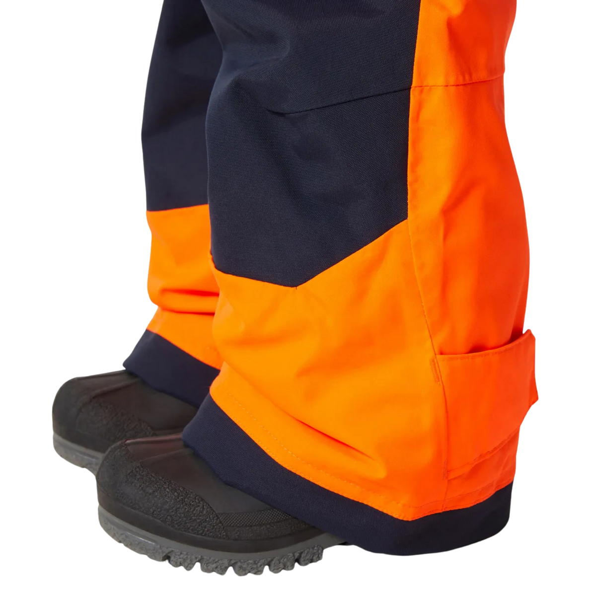 Helly Hansen Kids Rider 2.0 Insulated Bib Pants in Neon Orange with reinforced hem and adjustable bottom leg for added durability and fit