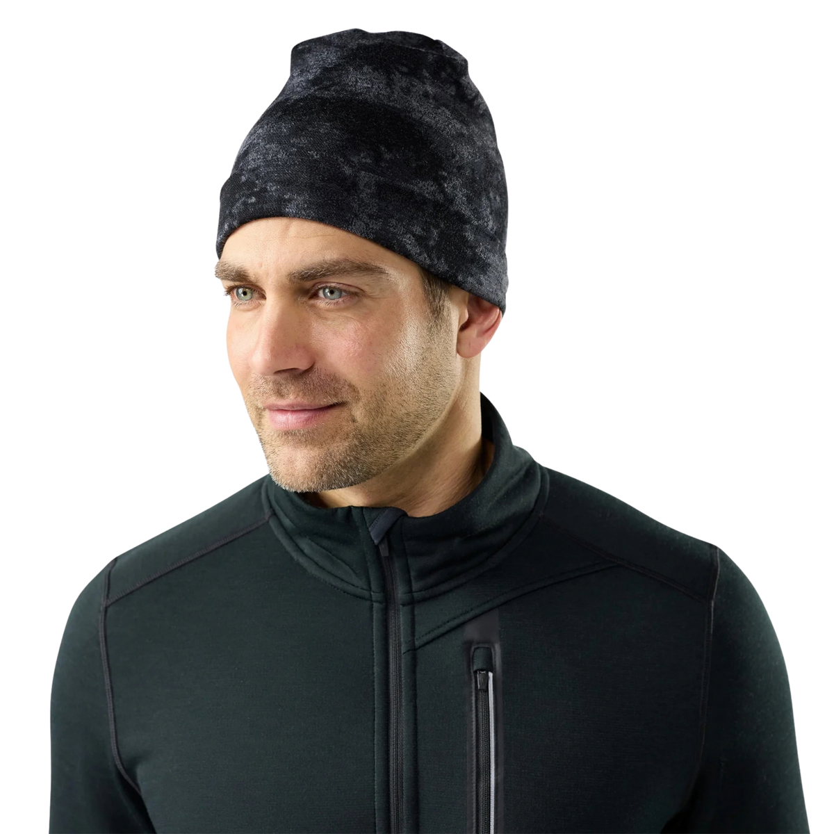 Front view of Smartwool Thermal Merino Reversible Cuffed Beanie in Black Tie Dye with midweight Merino wool and folded ear-warming cuff