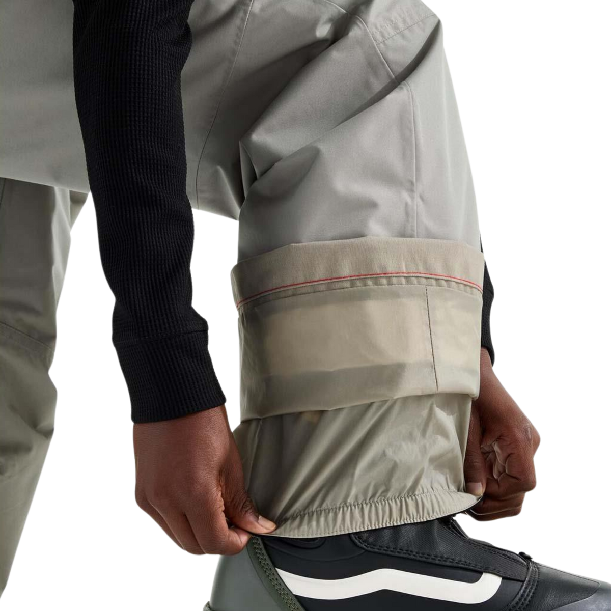The North Face Boys Freedom Insulated Pant in Stone Slab color with integrated leg gaiter designed to help limit snow entry around winter boots