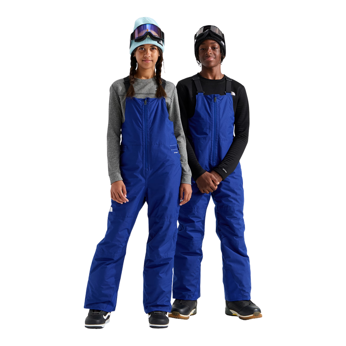 The North Face Teen Freedom Insulated Bib Pant in Bold Blue with waterproof DRYVENT 2L shell, HEATSEEKER insulation, adjustable suspenders and reinforced hems