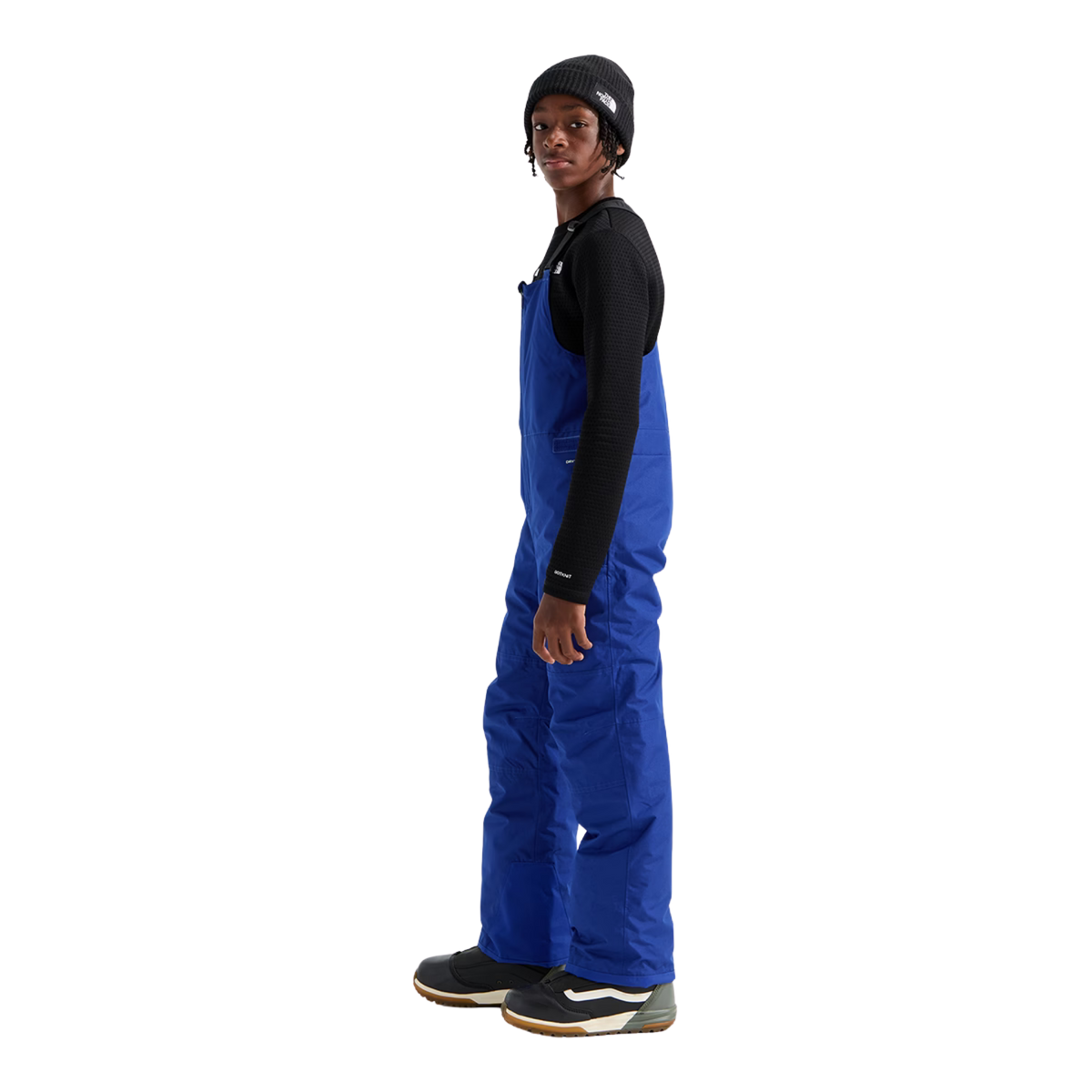 Side view of The North Face Teen Freedom Insulated Bib Pant in Bold Blue with insulated construction, adjustable waist and reinforced lower legs