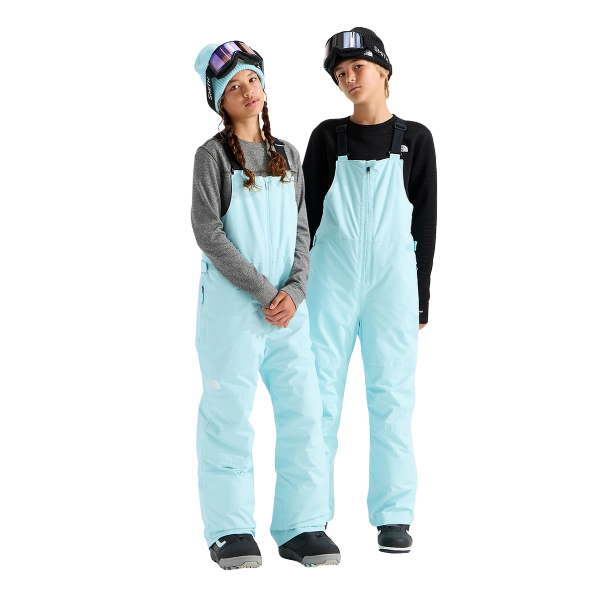 The North Face Teen Freedom Insulated Bib Pant in Glacier color with waterproof DRYVENT 2L shell, HEATSEEKER insulation, adjustable suspenders and reinforced hems