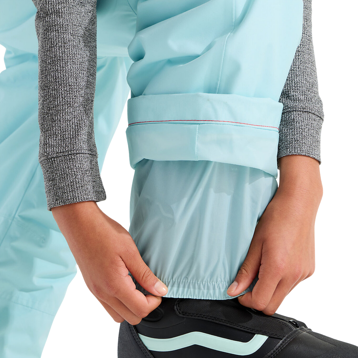 The North Face Teen Freedom Insulated Bib Pant in Glacier color with integrated leg gaiter designed to help limit snow entry around boots