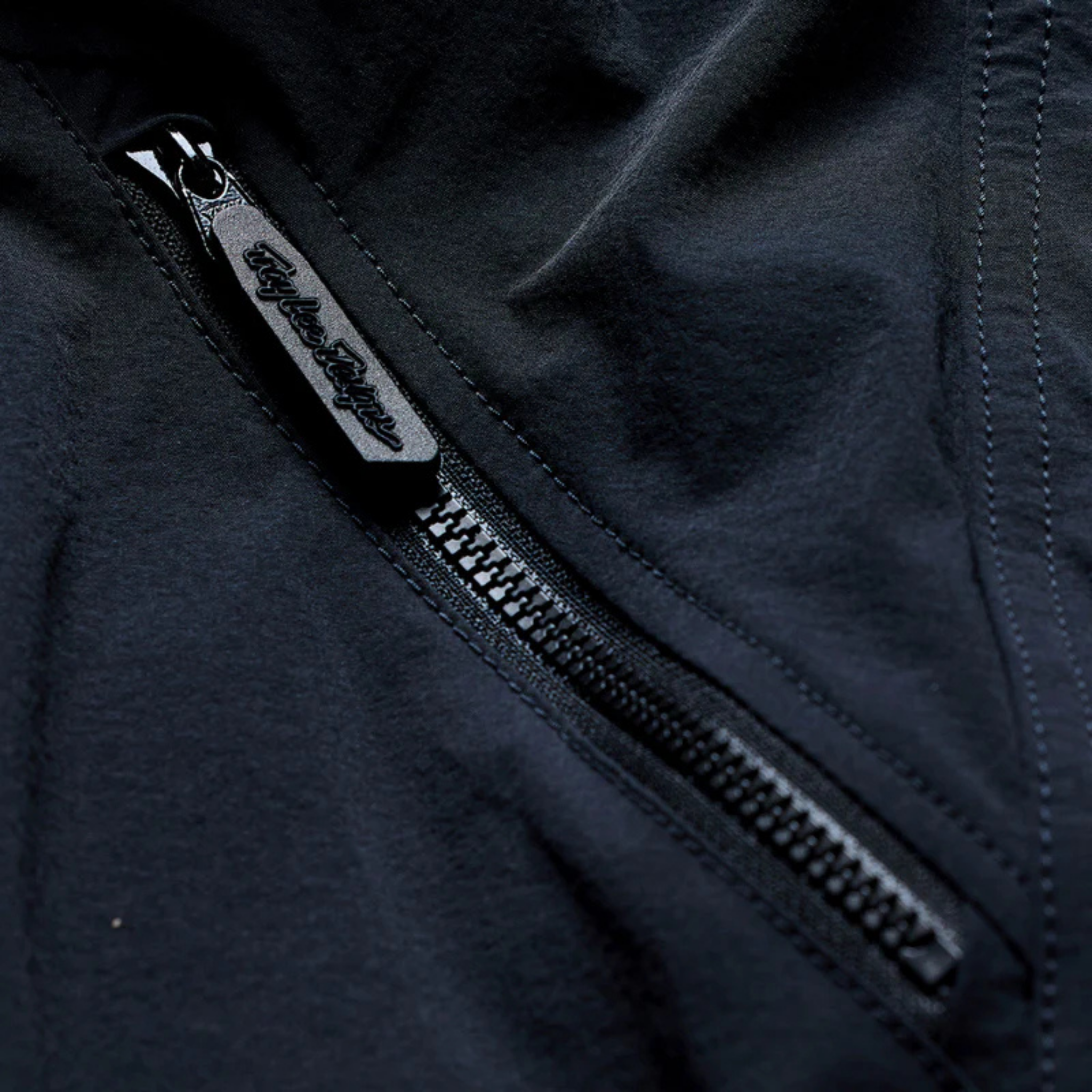 Close-up of Troy Lee Designs Skyline Trail Pant Mono Army with YKK zippered storage pocket