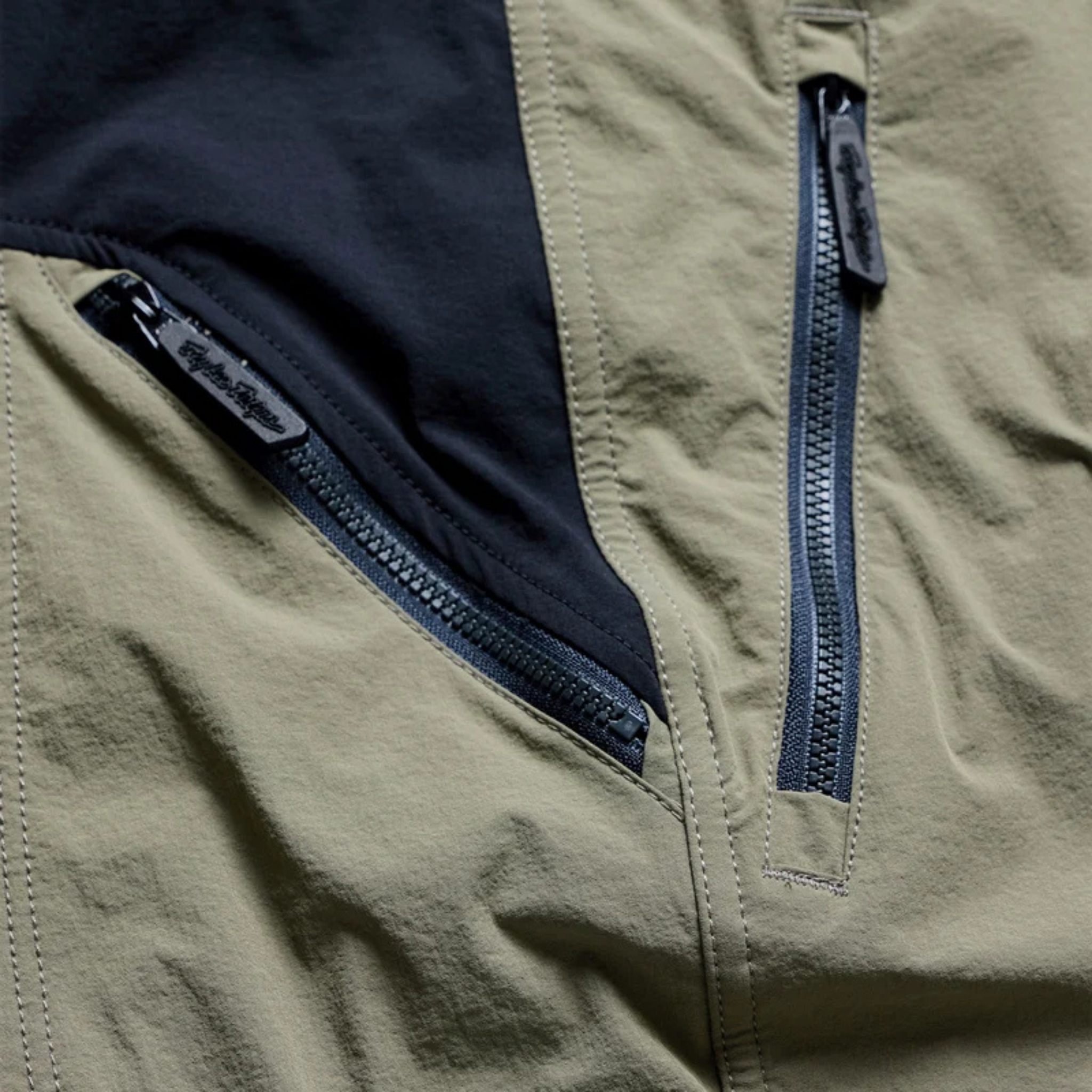 Close-up of Troy Lee Designs Skyline Trail Pant Mono Army with YKK Zippers