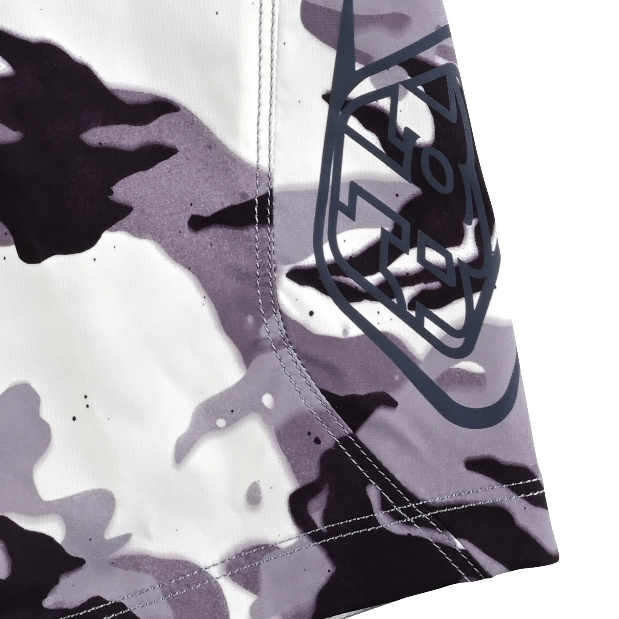 Side profile of Troy Lee Designs Youth Flowline Short Shell in Spray Camo White showing lightweight construction