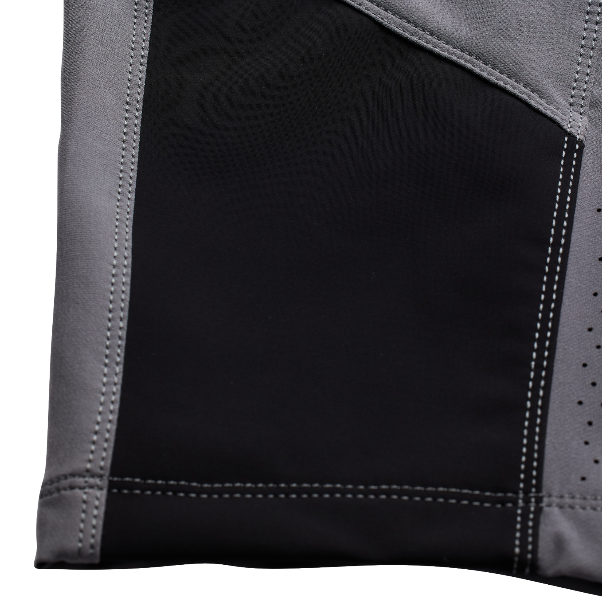 Close-up of the cowhide chain abrasion protection on Troy Lee Designs Youth Sprint Pants in Mono Charcoal