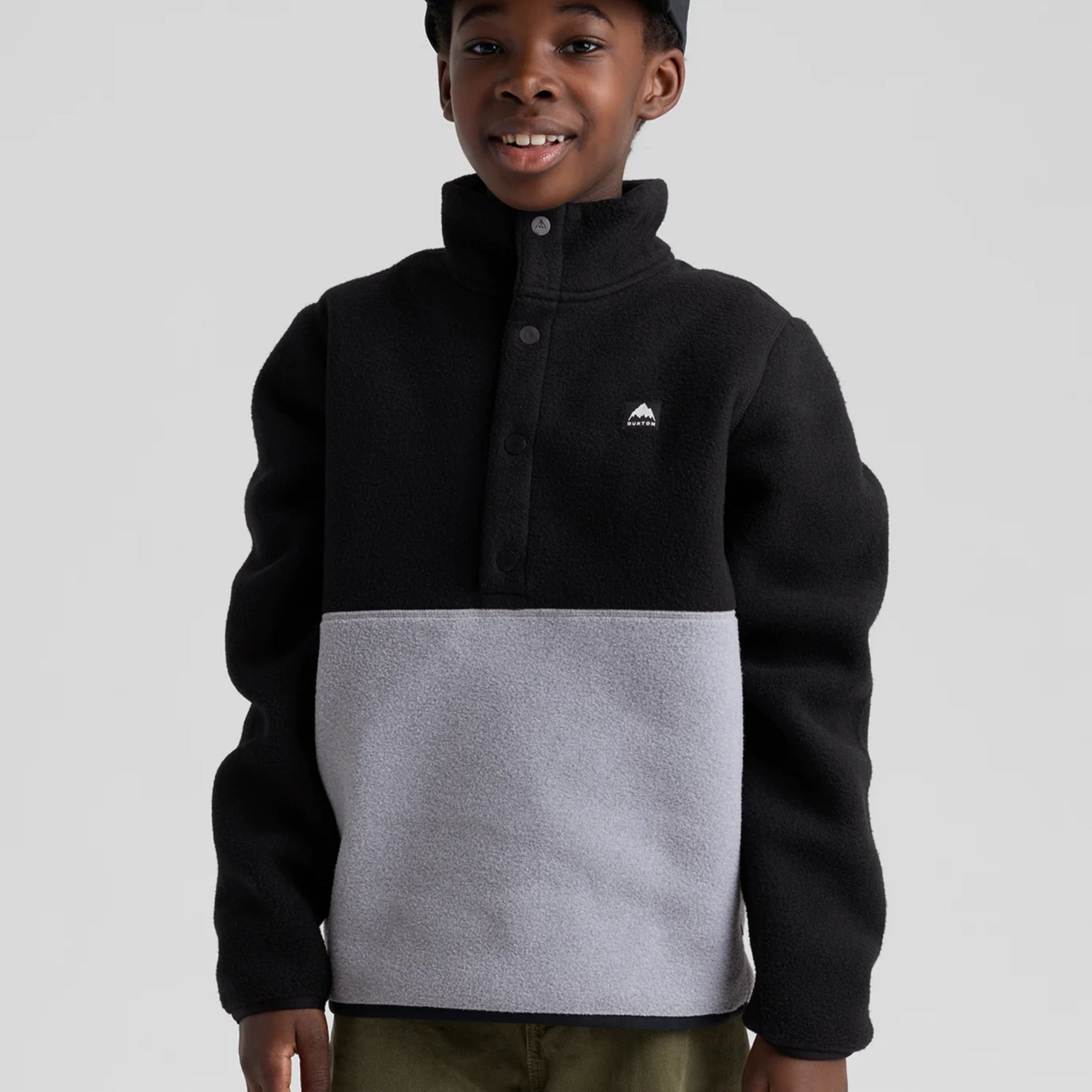 Front view of Burton Kids Cinder Fleece Anorak in True Black and Grey Heather with reinforced snap front placket