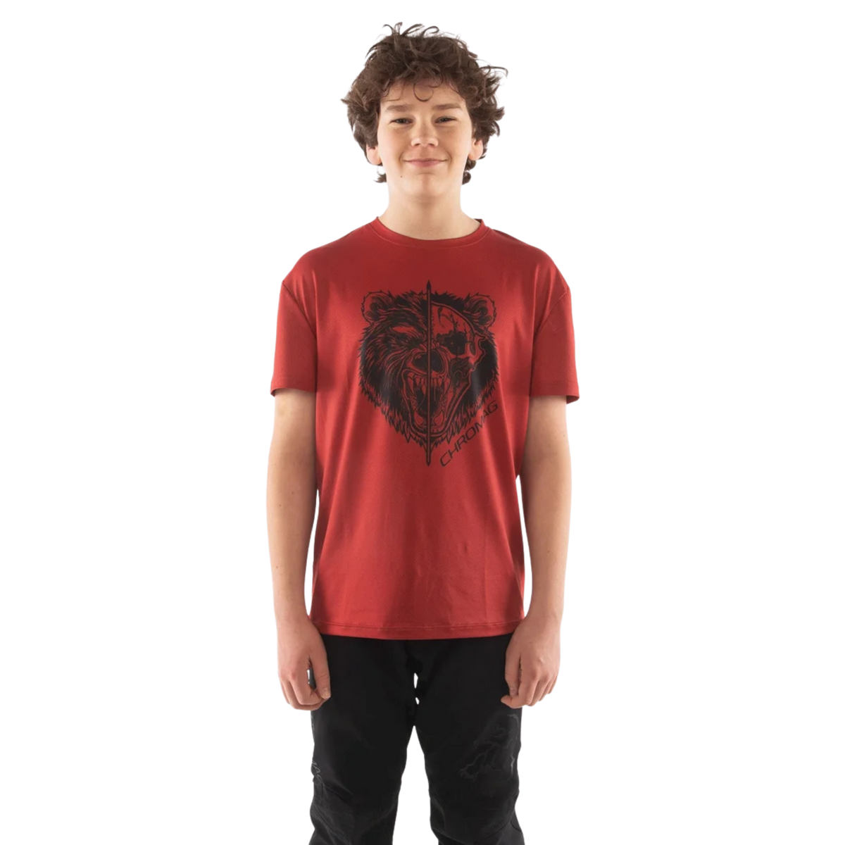 Young rider wearing Chromag Method Tech T-Shirt with breathable stretch fabric while mountain biking in Whistler Bike Park