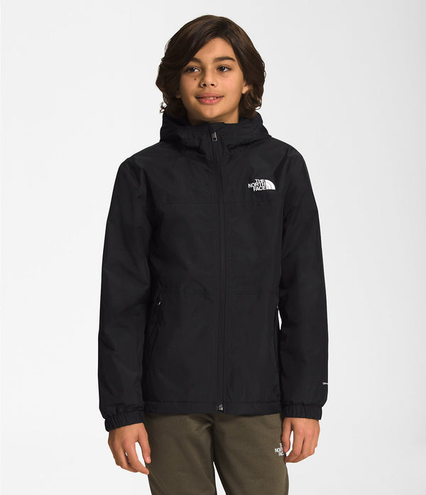 Boy wearing black North Face Boys' Warm Storm Jacket from Mountain Kids Outfitters, ready for cold and rainy weather.