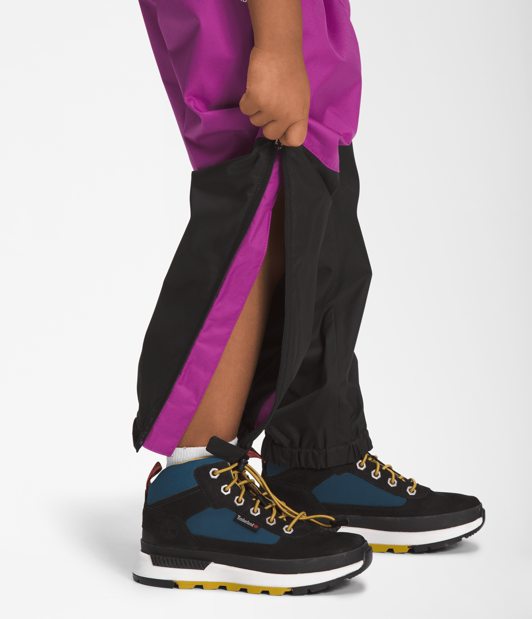 Leg of The North Face Kids Antora Rain Pants in Purple Cactus Flower with reverse-coil leg zips open from cuff to knee for easy on/off.